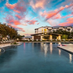 a pool with a building in the background