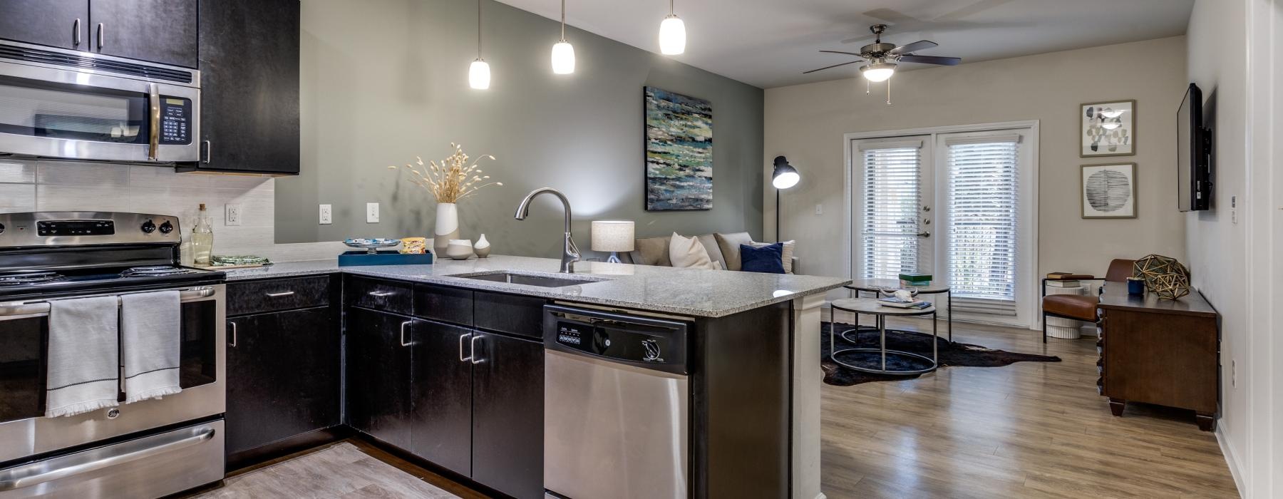 a kitchen with black appliances