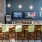 a room with a bar and chairs