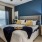 a bedroom with a bed and a fan